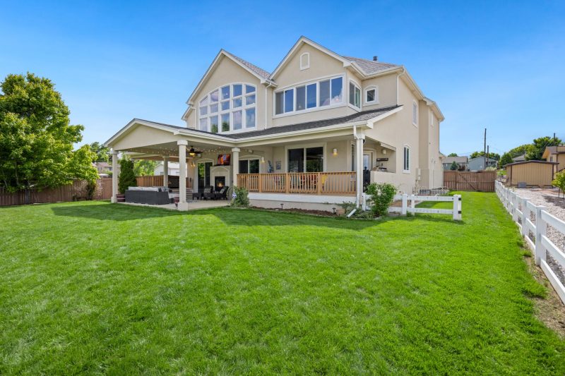 Home 10 Beautiful twostory suburban house with a large green lawn an 1783443846